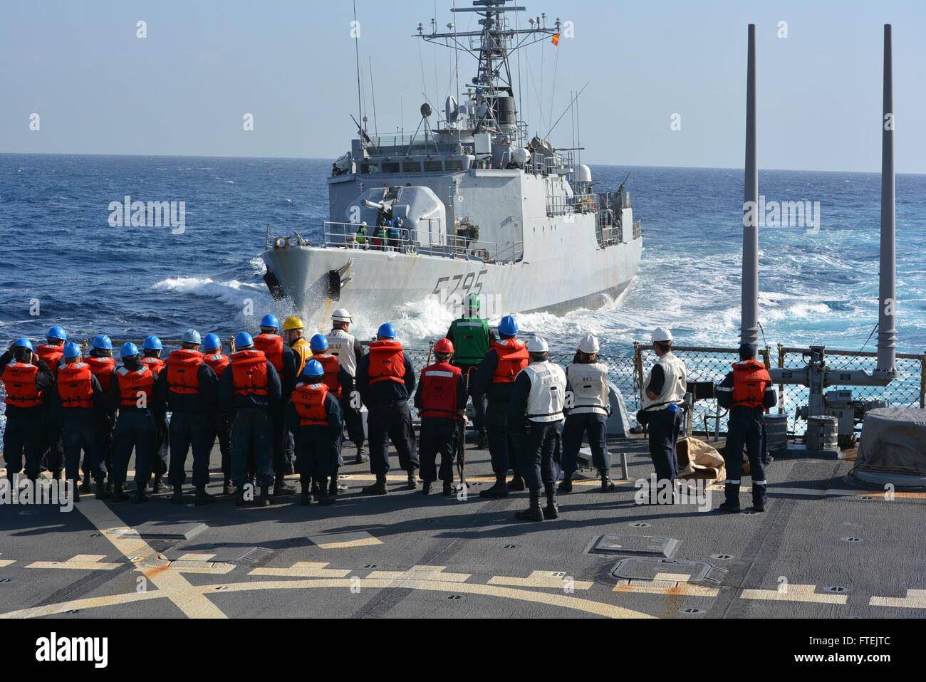 MEDITERRANEAN SEA (Dec. 29, 2014) The French military dispatch vessel Commandant Ducuing makes an approach on USS Cole (DDG 67) during a Passing Exercise Dec. 29, 2014. Cole, an Arleigh Burke-class guided-missile destroyer homeported in Norfolk, is conducting naval operations in the U.S. 6th Fleet area of operations in support of. Stock Photo