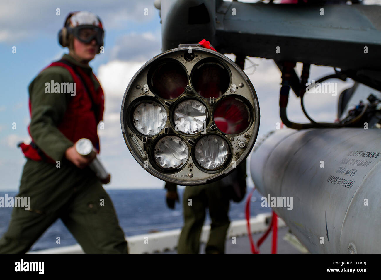 150107-M-WA276-050 MEDITERRANEAN SEA (Jan. 7, 2015) Corporal Stephen Cusson, an aviation ordnance technician assigned to the Marine Medium Tiltrotor Squadron 365 (Reinforced), 24th Marine Expeditionary Unit, loads a 2.75-inch rocket in to a LAU-68 rocket pod attached to an AH-1W Cobra attack helicopter aboard USS Iwo Jima (LPD 7) Jan. 7, 2015. The 24th MEU and Iwo Jima Amphibious Ready Group are conducting naval operations in the U.S. 6th Fleet area of operations in support of U.S. national security interests in Europe. (U.S. Marine Corps photo by Lance Corporal Dani A. Zunun/Released) Stock Photo