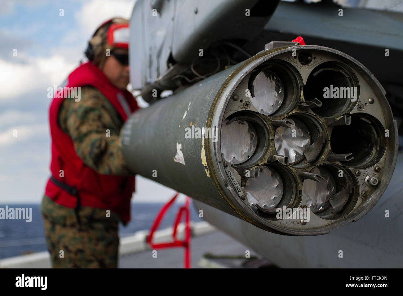 150107-M-WA276-052 MEDITERRANEAN SEA (Jan. 7, 2015) Gunnery Sergeant Edward Lujan, an aviation ordnance chief with Marine Medium Tiltrotor Squadron 365 (Reinforced), 24th Marine Expeditionary Unit, loads a 2.75-inch rocket in to a LAU-68 rocket pod attached to an AH-1W Cobra attack helicopter aboard USS Iwo Jima (LPD 7) Jan. 7, 2015. The 24th MEU and Iwo Jima Amphibious Ready Group are conducting naval operations in the U.S. 6th Fleet area of operations in support of U.S. national security interests in Europe. (U.S. Marine Corps photo by Lance Corporal Dani A. Zunun) Stock Photo