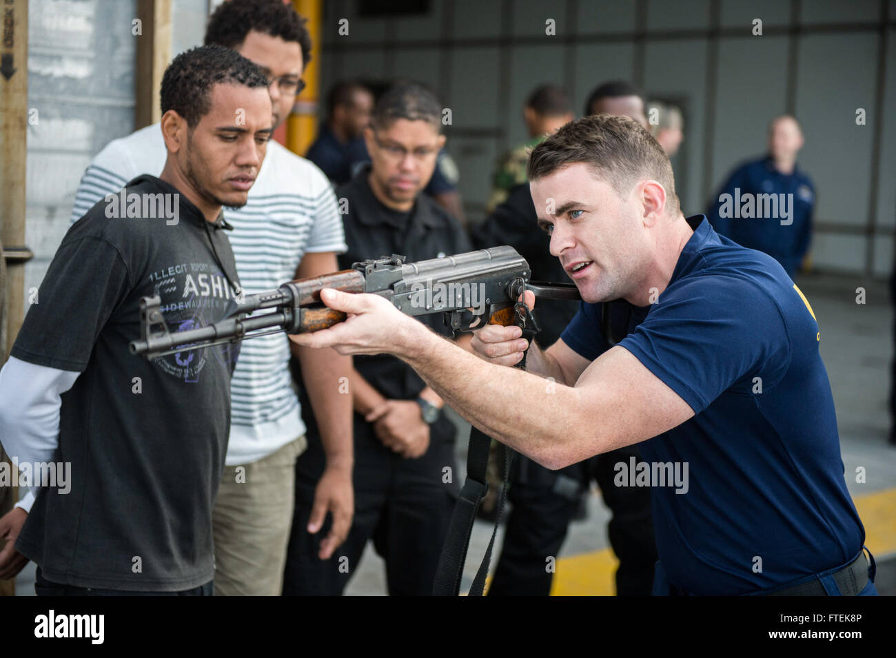 Coast guard maritime enforcement specialist hires stock photography