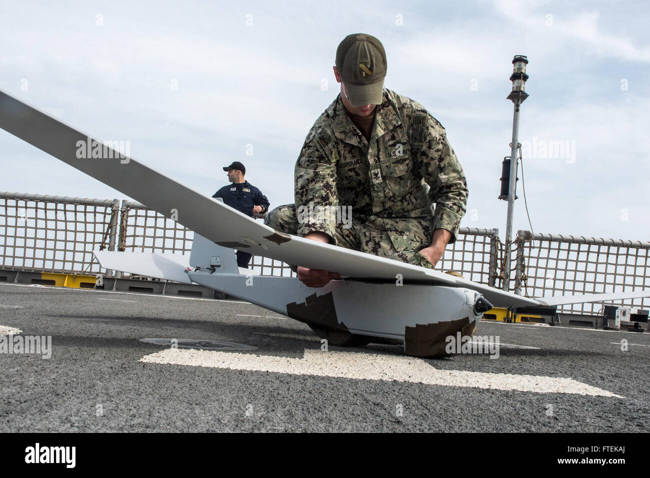 150116-N-JP249-016 ATLANTIC OCEAN (Jan. 16, 2015) Intelligence Specialist 2nd Class Joshua Lesperance, from Spring Valley, Illinois, pieces together a Puma Unmanned Aircraft System from the Coastal Riverine Force, while aboard the Military Sealift Command’s joint high-speed vessel USNS Spearhead (JHSV 1) Jan. 16, 2015. Spearhead is on a scheduled deployment to the U.S. 6th Fleet area of operations in support of the international collaborative capacity-building program Africa Partnership Station. (U.S. Navy photo by Mass Communication Specialist 2nd Class Kenan O’Connor/Released) Stock Photo