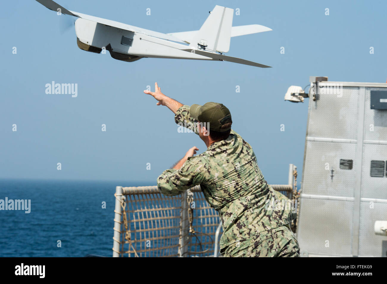 150126-N-JP249-028 ATLANTIC OCEAN (Jan. 26, 2015) Information Systems Technician 2nd Class Joshua Lesperance, from Spring Valley, Illinois, launches an RQ-20A Aqua Puma small unmanned aircraft system from the flight deck of the Military Sealift Command’s joint high-speed vessel USNS Spearhead (JHSV 1) Jan 26, 2015. Spearhead is on a scheduled deployment to the U.S. 6th Fleet area of operations in support of the international collaborative capacity-building program Africa Partnership Station. (U.S. Navy photo by Mass Communication Specialist 2nd Class Kenan O’Connor/Released) Stock Photo