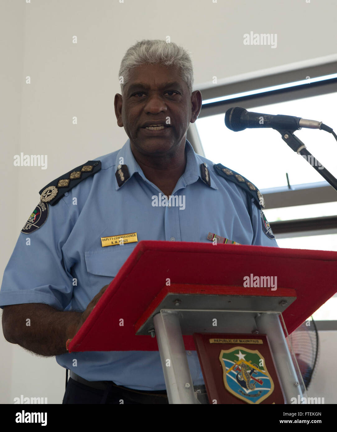150128-N-QY759-075 LE CHALAND, Mauritius (Jan. 28, 2015) Mauritian Deputy Commissioner of Police Mario Nobin addresses attendees during the opening ceremony of Exercise Cutlass Express 2015, Jan. 28. Exercise Cutlass Express 2015, sponsored by U.S. Africa Command, is designed to improve regional cooperation, maritime domain awareness, and information sharing practices to increase capabilities of East African and Indian Ocean nations to counter sea-based illicit activity. (U.S. Navy photo by Mass Communication Specialist 1st Class David R. Krigbaum/Released) Stock Photo