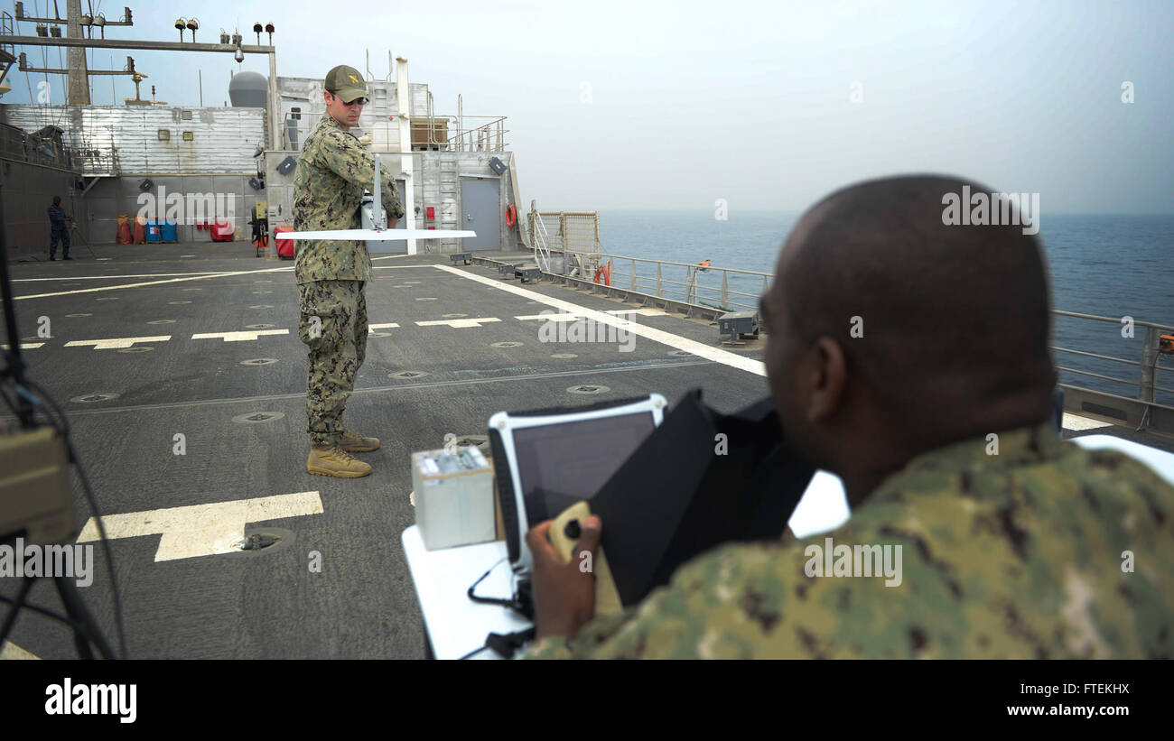 150129-N-RB579-059 ATLANTIC OCEAN (Jan. 29, 2015) Information Technology Specialist 2nd Class Joshua Lesperance, left, and Operations Specialist Chief Dwayne Brown conduct final checks before launching the Puma unmanned aerial vehicle during maritime law enforcement operations aboard the USNS Spearhead (JHSV 1), Jan. 29, 2015. Spearhead is on a scheduled deployment to the U.S. 6th Fleet area of operations in support of the international collaborative capacity-building program Africa Partnership Station. (U.S. Navy photo by Mass Communication Specialist 1st Class Joshua Davies/Released) Stock Photo