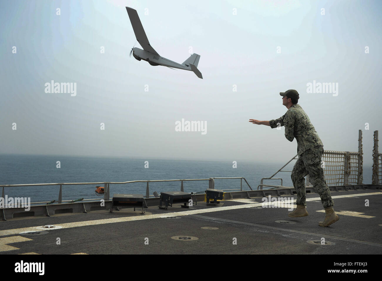 150129-N-RB579-072 ATLANTIC OCEAN (Jan. 29, 2015) Information Technology Specialist 2nd Class Joshua Lesperance launches a Puma unmanned aerial vehicle during maritime law enforcement operations aboard the USNS Spearhead (JHSV 1), Jan. 29, 2015. Spearhead is on a scheduled deployment to the U.S. 6th Fleet area of operations in support of the international collaborative capacity-building program Africa Partnership Station. (U.S. Navy photo by Mass Communication Specialist 1st Class Joshua Davies/Released) Stock Photo