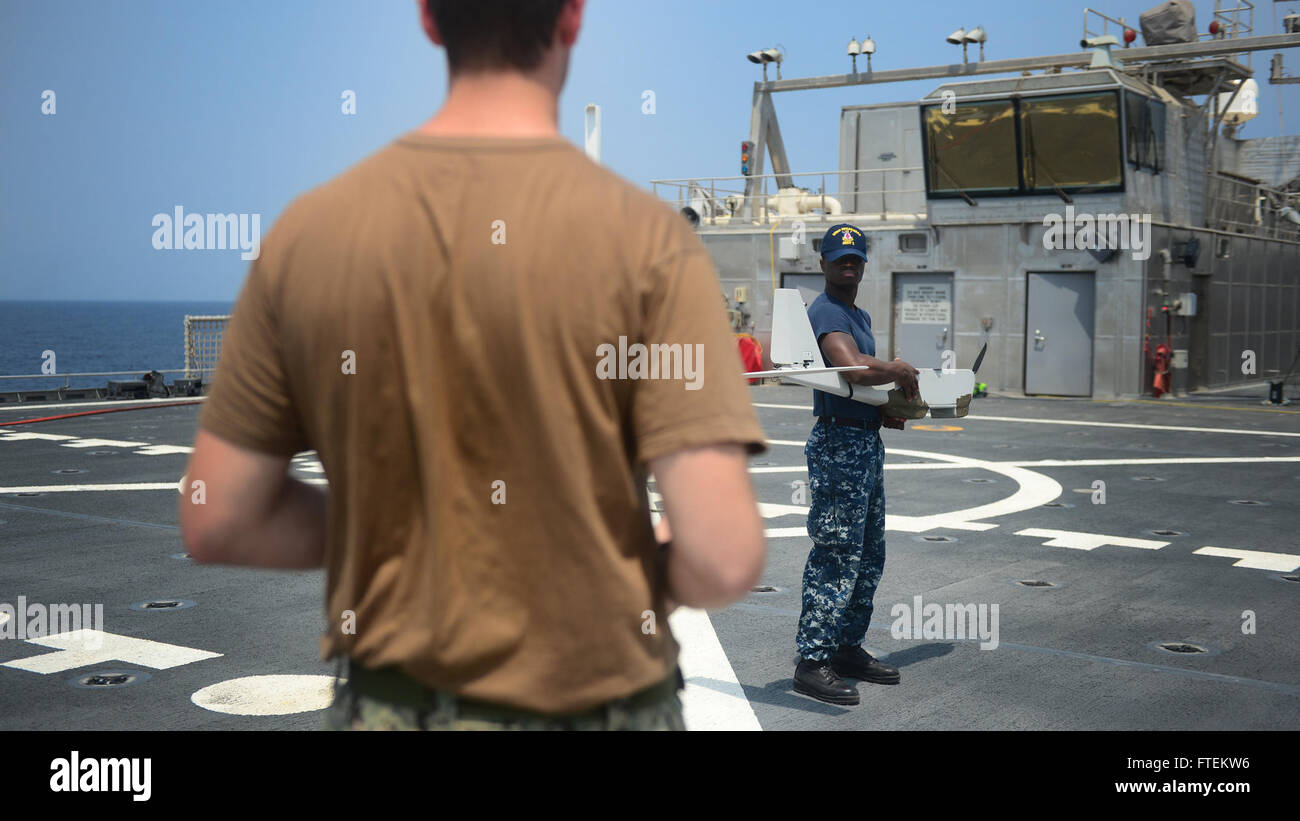 ATLANTIC OCEAN (Feb. 10, 2015) Information Technology Specialist 3rd Class Marquise Simmons, from Summerville, South Carolina, right, conducts pre-flight checks on the RQ-20A  Aqua Puma small unmanned aircraft system aboard the Military Sealift Command's joint high-speed vessel USNS Spearhead (JHSV 1) Feb. 10, 2015. Spearhead is on a scheduled deployment to the U.S. 6th Fleet area of operations in support of the international collaborative capacity-building program Africa Partnership Station (APS). (U.S. Navy photo by Mass Communication Specialist 1st Class Joshua Davies/Rel Stock Photo