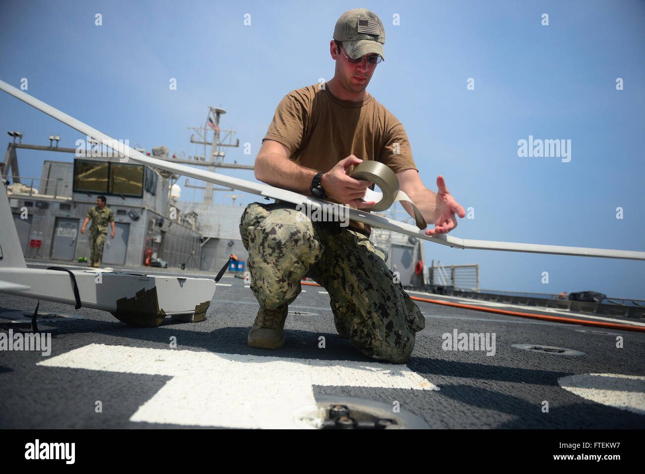 ATLANTIC OCEAN (Feb. 10, 2015) Information Technology Specialist 2nd Class Joshua Lesperance, from Spring Valley, Illinois, conducts routine maintenance on the RQ-20A  Aqua Puma small unmanned aircraft system aboard the Military Sealift Command's joint high-speed vessel USNS Spearhead (JHSV 1) Feb. 10, 2015. Spearhead is on a scheduled deployment to the U.S. 6th Fleet area of operations in support of the international collaborative capacity-building program Africa Partnership Station (APS). (U.S. Navy photo by Mass Communication Specialist 1st Class Joshua Davies/Released) Stock Photo