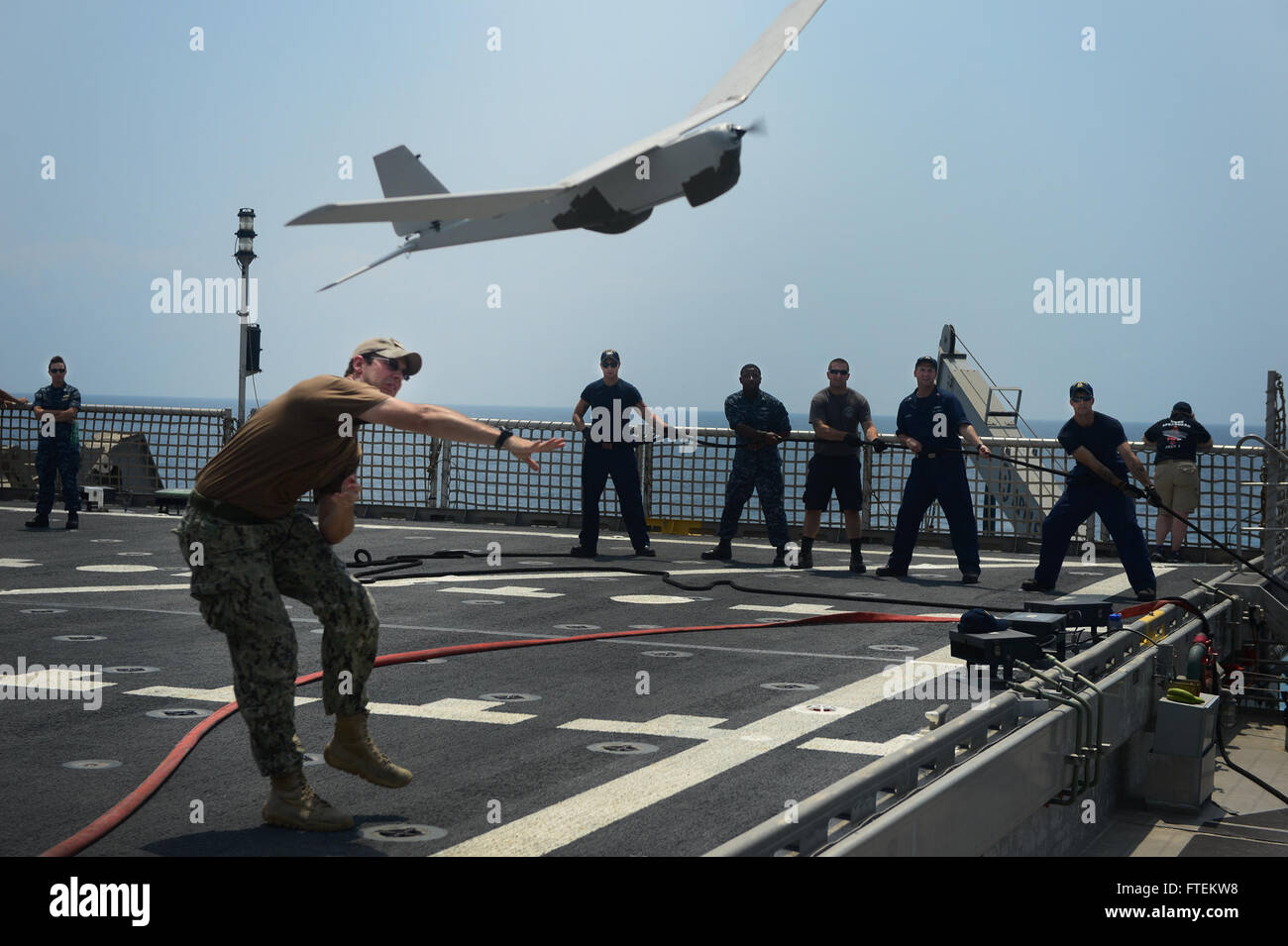 ATLANTIC OCEAN (Feb. 10, 2015) Information Technology Specialist 2nd Class Joshua Lesperance, from Spring Valley, Illinois, launches the RQ-20A  Aqua Puma small unmanned aircraft system off the flight deck of the Military Sealift Command's joint high-speed vessel USNS Spearhead (JHSV 1) Feb. 10, 2015. Spearhead is on a scheduled deployment to the U.S. 6th Fleet area of operations in support of the international collaborative capacity-building program Africa Partnership Station (APS). (U.S. Navy photo by Mass Communication Specialist 1st Class Joshua Davies/Released) Stock Photo