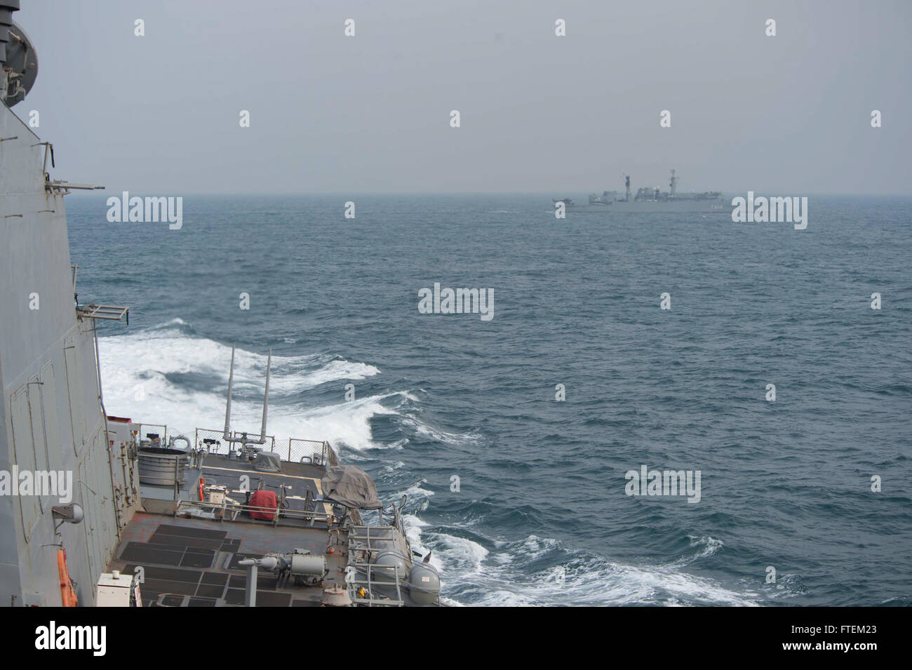 BLACK SEA (Feb. 19, 2015) USS Cole (DDG 67) maneuvers during a divisional-tactics evolution with the Romanian navy frigate ROS Regina Maria (F 222) Feb. 19, 2015. Cole, an Arleigh Burke-class guided-missile destroyer, homeported in Norfolk, is conducting naval operations in the U.S. 6th Fleet area of operations in support of U.S. national security interests in Europe. Stock Photo