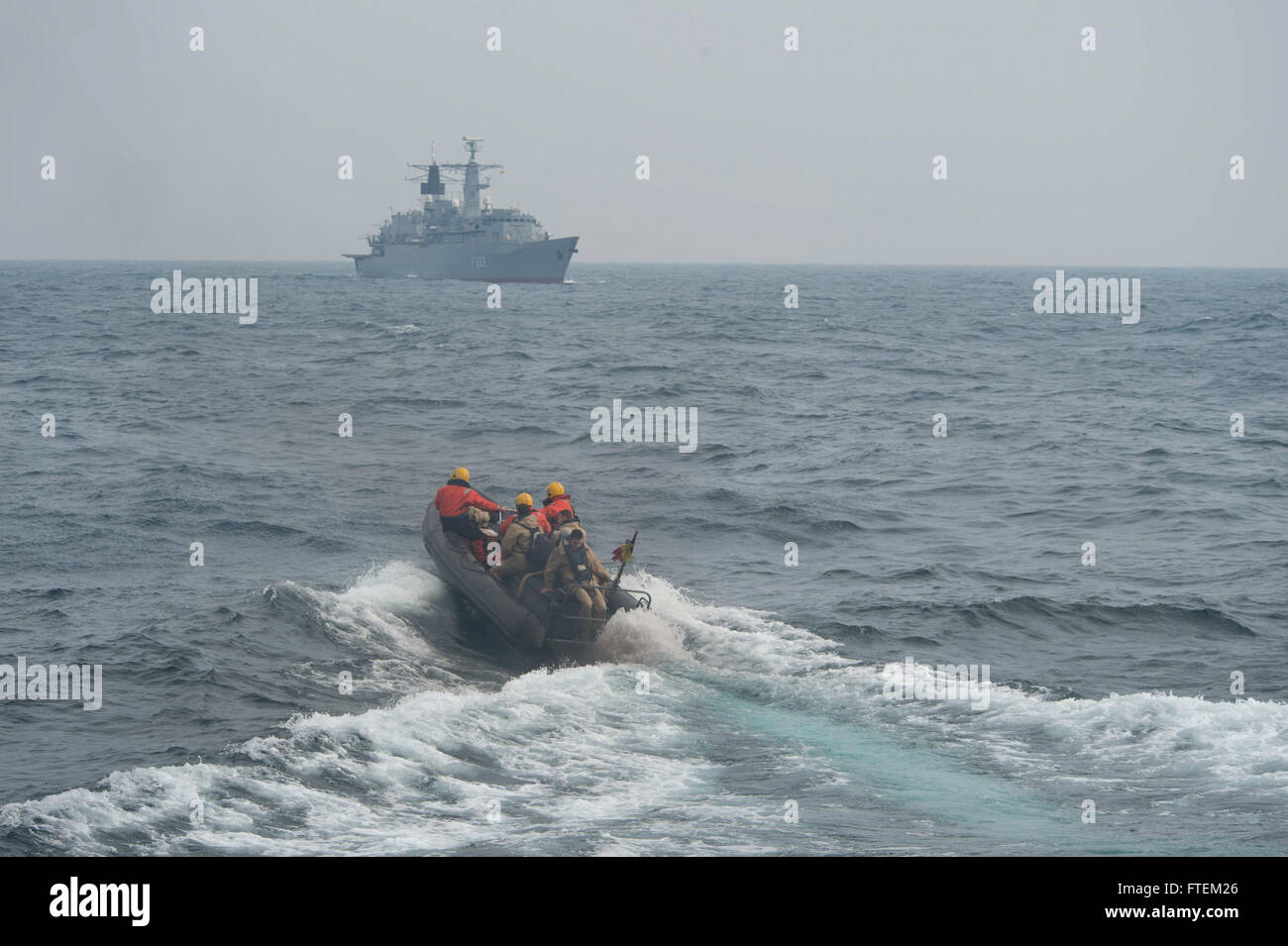 BLACK SEA (Feb. 19, 2015) Romanian sailors are taken to the Romanian navy frigate ROS Regina Maria (F 222) during a small boat transfer with USS Cole (DDG 67) Feb. 19, 2015. Cole, an Arleigh Burke-class guided-missile destroyer, homeported in Norfolk, is conducting naval operations in the U.S. 6th Fleet area of operations in support of U.S. national security interests in Europe. Stock Photo