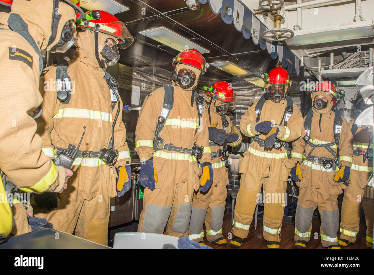 ATLANTIC OCEAN (Feb. 19, 2015) USS Laboon (DDG 58) Sailors prepare to take part in a fire drill aboard ship Feb. 19, 2015. Laboon, an Arleigh Burke-class guided-missile destroyer home ported in Norfolk, is underway conducting naval operations in the U.S. 6th Fleet area of operations in support of U.S. national security interests in Europe. Stock Photo