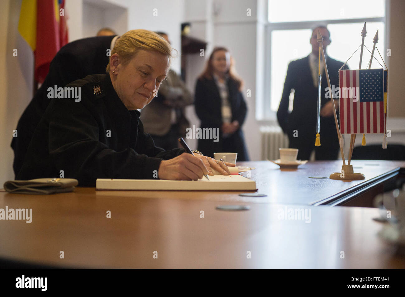 DEVESELU, Romania (Feb. 21, 2015) Deputy Commander, U.S. Fleet Forces Command, Vice Adm. Nora W. Tyson signs the Distinguished Visitor Book at the Romanian 99th Military Base Headquarters, Feb. 21, 2015. The Romanian 99th Military Base surrounds Naval Support Facility (NSF) Deveselu providing an additional layer of security. NSF Deveselu is Navy Region Europe Africa Southwest Asia’s latest tool for providing efficient and effective shore service support to United States and Allied Forces operating in Europe, Africa and Southwest Asia. Stock Photo