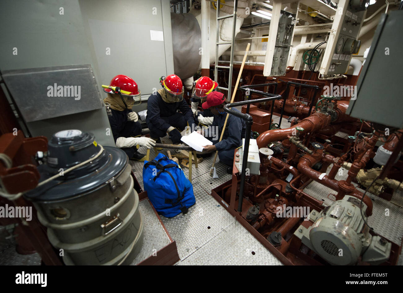 MEDITERRANEAN SEA (Feb. 23, 2015) Sailors conduct pipe patching procedures during a general quarters drill aboard USS Donald Cook (DDG 75) Feb. 23, 2015. Donald Cook, an Arleigh Burke-class guided-missile destroyer, forward-deployed to Rota, Spain, is conducting naval operations in the U.S. 6th Fleet area of operations in support of U.S. national security interests in Europe. Stock Photo