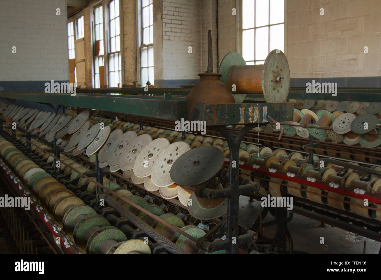 Oil can and empty thread spools in turn of the century silk throwing