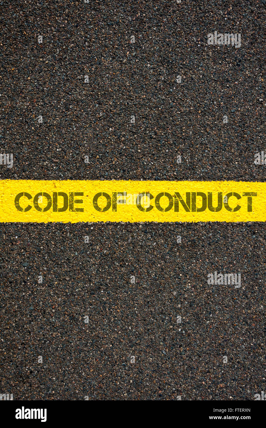Road marking yellow paint dividing line with words CODE OF CONDUCT