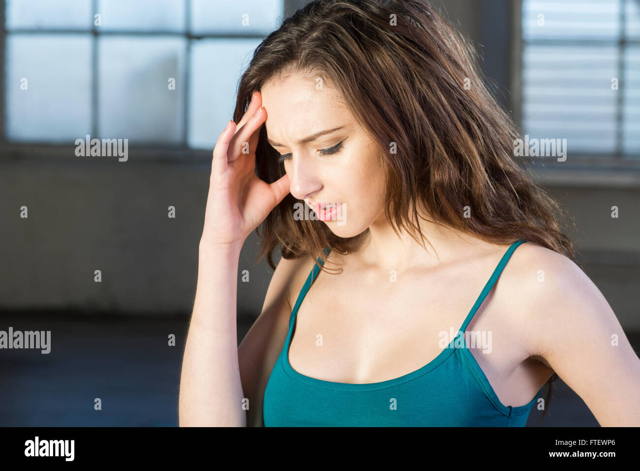 Young woman with a headache Stock Photo