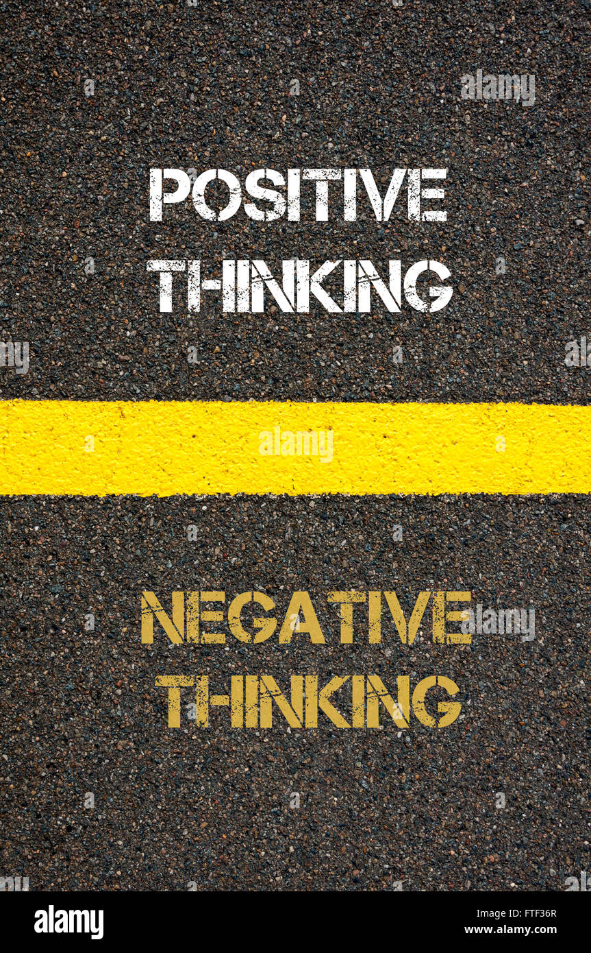 Antonym decision concept of NEGATIVE THINKING versus POSITIVE THINKING written over tarmac Stock Photo