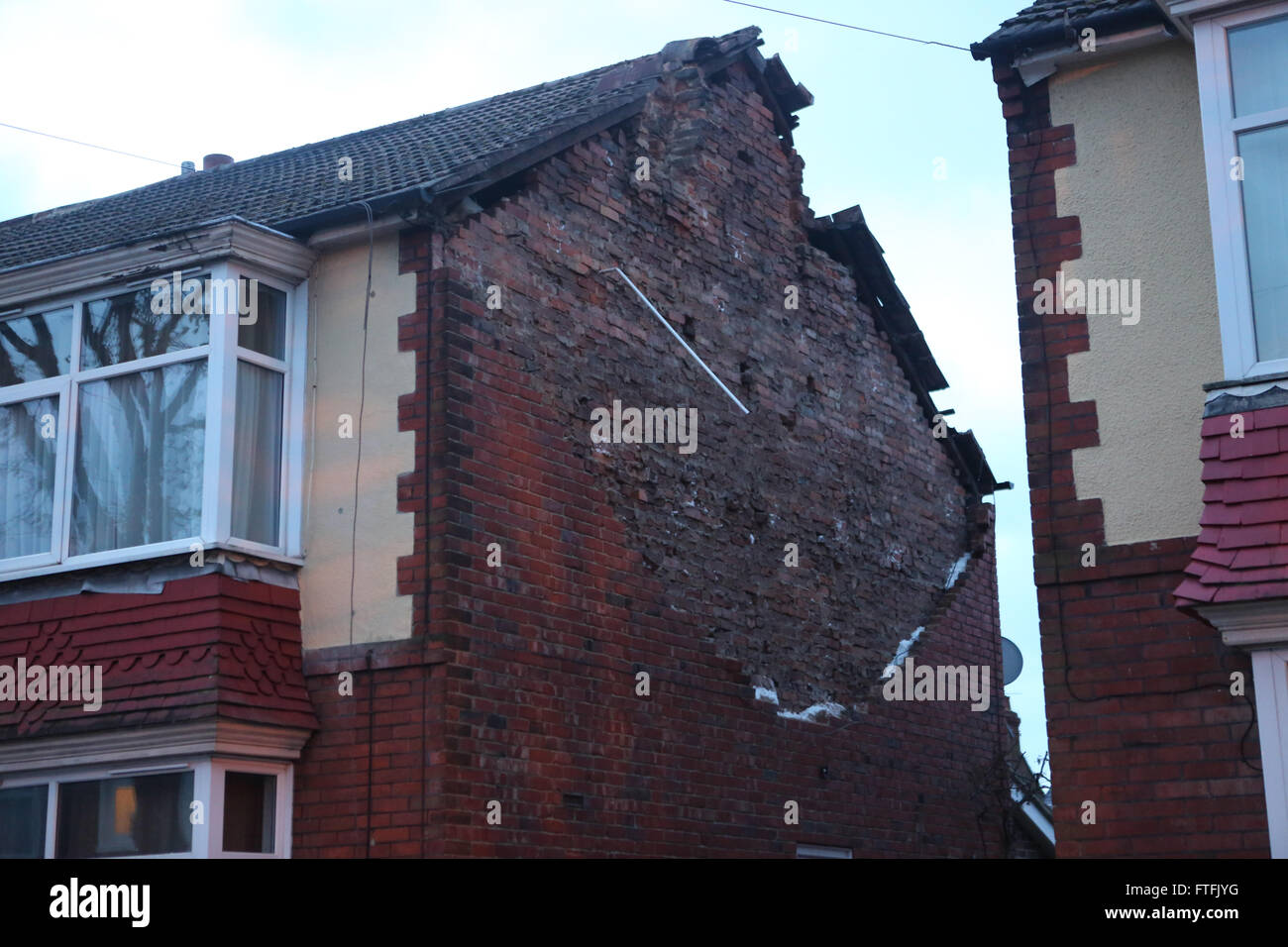 Portsmouth, Hampshire, UK. 28th March, 2016.  Storm Katie hit the South Coast with wind speed recorded of over 109 mph.  Overnight, there was some disruption and a lot of wind damage has been reported due to winds of up to 106 mph recorded on Needles on the Isle of Wight    This  Portsmouth Street is cordoned off after the gable end collapsed on the property  just after 2am  Two fire crews from Southsea fire station in Portsmouth attended and made safe a roof in a dangerous condition in Copnor Credit:  uknip/Alamy Live News Stock Photo