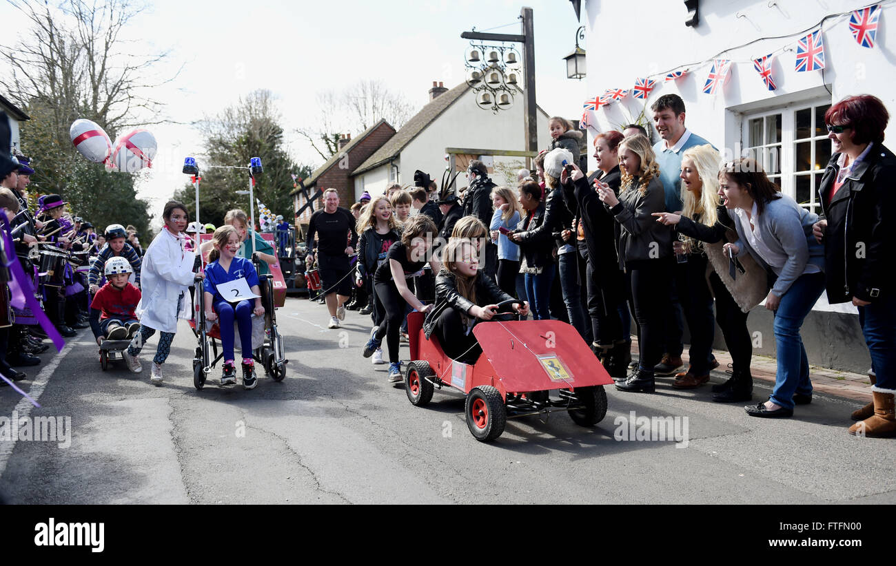 Bolney, Sussex, UK. 28th March, 2016.  Competitors in the Junior section take part in the Bolney Pram Races held every year on Easter Bank Holiday Monday . This year they are raising money for Chailey Heritage and the Service by Emergency Rider Services charities  Credit:  Simon Dack/Alamy Live News Stock Photo
