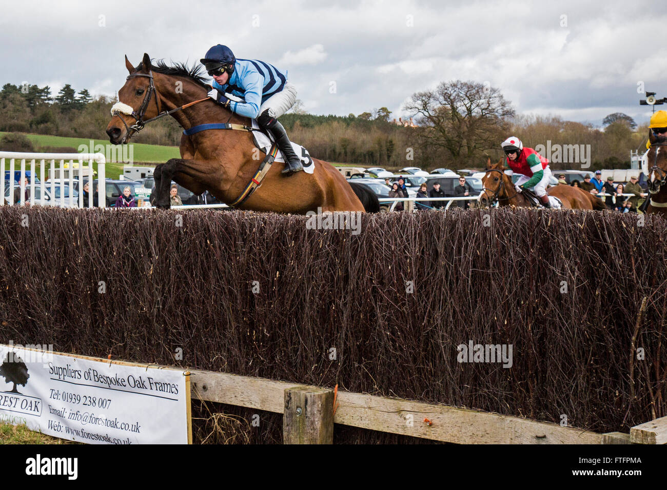 Eyton-on-Severn in Shropshire, UK. 28th March, 2016. 'Ring Ben', ridden by Paddy Gerety, and owned by Mr. P. A. Jones, in the first race, The North and South Shropshire Hunt members, Subscribers & Farmers Race, at the Easter Bank Holiday Point to Point races. Stock Photo