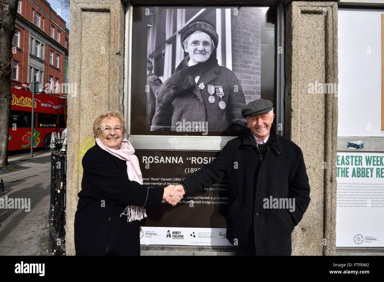 Dublin, Ireland. 28th Mar, 2016. Gerry and Lillian Carroll posing in front of murals that commemorate members of the Abbey Theatre's involvement in the historic 1916 Easter Rising that lay the foundations for a free and independent Irish State on Easter Monday, March 28, 2016, Dublin, Ireland. © Rory Merry/ZUMA Wire/Alamy Live News Stock Photo