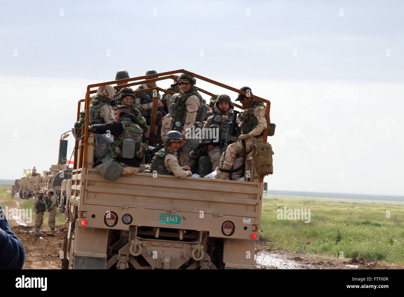 Mosul, Mosul in north Iraq. 28th Mar, 2016. A convoy of military vehicles of the Iraqi Army are seen at the front line in Makhmur City, 50 kilometers south of Mosul in north Iraq, on March 28, 2016. © Yaser Jawad/Xinhua/Alamy Live News Stock Photo