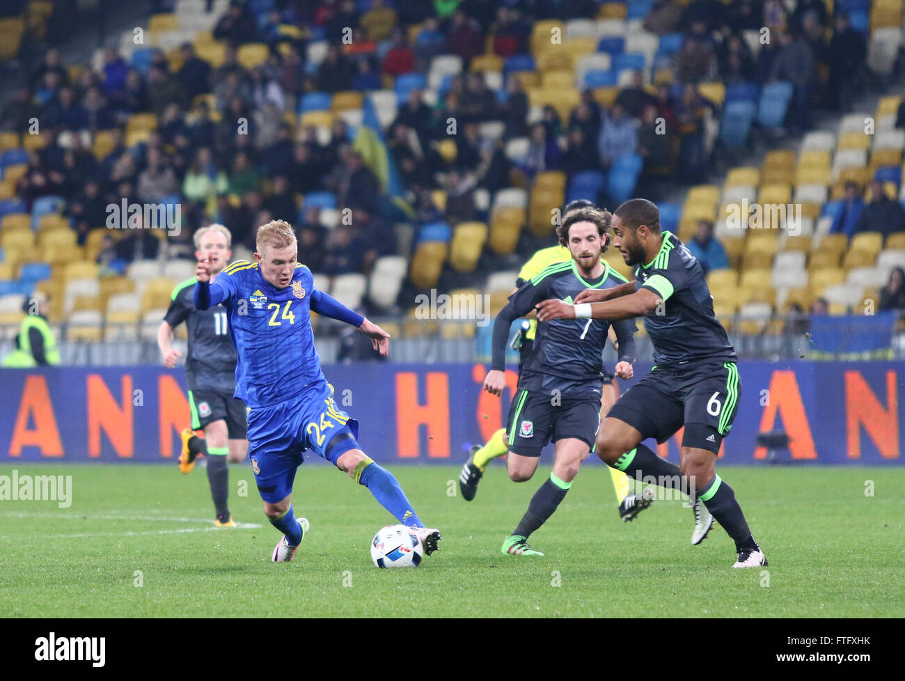 Kyiv, Ukraine. 28th March, 2016. Viktor Kovalenko of Ukraine (L, #24) fights for a ball with Ashley Williams of Wales (#6) during their Friendly match at NSC Olympic stadium in Kyiv, Ukraine. Ukraine won 1-0. Credit:  Oleksandr Prykhodko/Alamy Live News Stock Photo