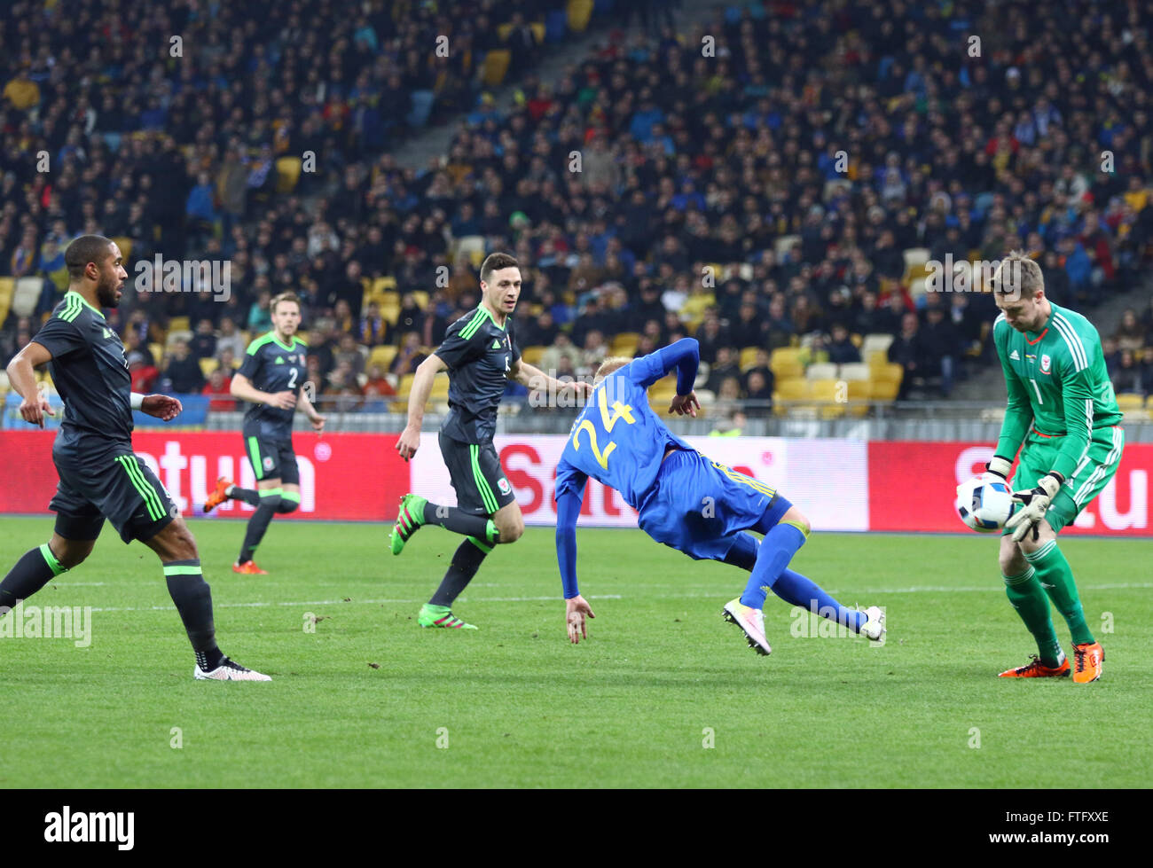 Kyiv, Ukraine. 28th March, 2016. Viktor Kovalenko of Ukraine (in Blue) attacks during the Friendly match against Wales at NSC Olympic stadium in Kyiv, Ukraine. Ukraine won 1-0. Credit:  Oleksandr Prykhodko/Alamy Live News Stock Photo