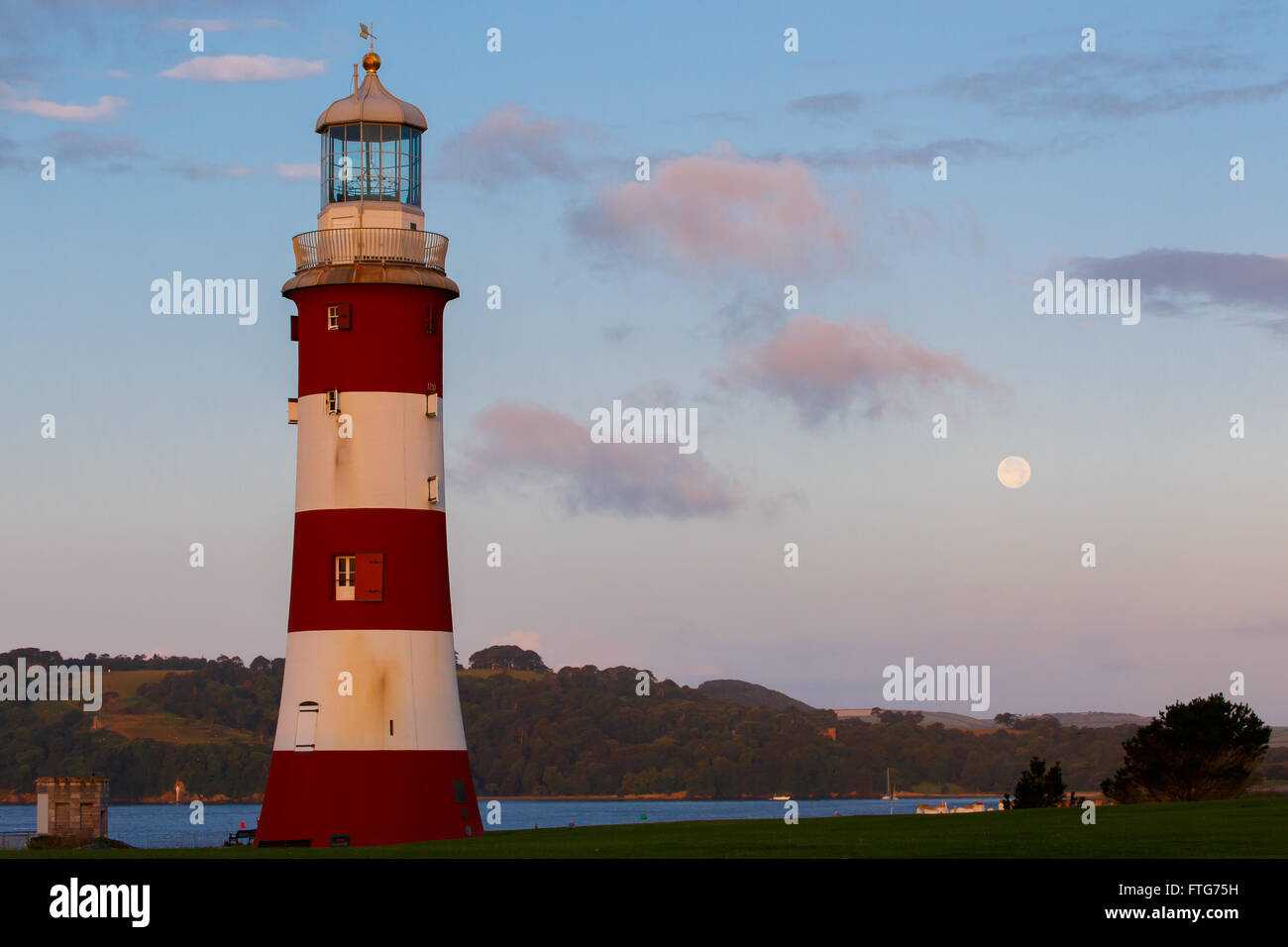 Smeaton's Tower on Plymouth Hoe at sunset. Plymouth, Devon, UK.  The iconic lighthouse previously stood on Eddystone Rock. Stock Photo