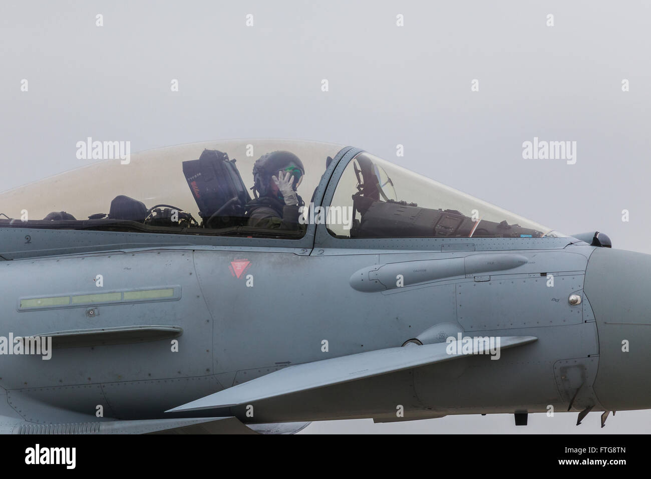 RAF pilot waving from his Typhoon cockpit. Stock Photo
