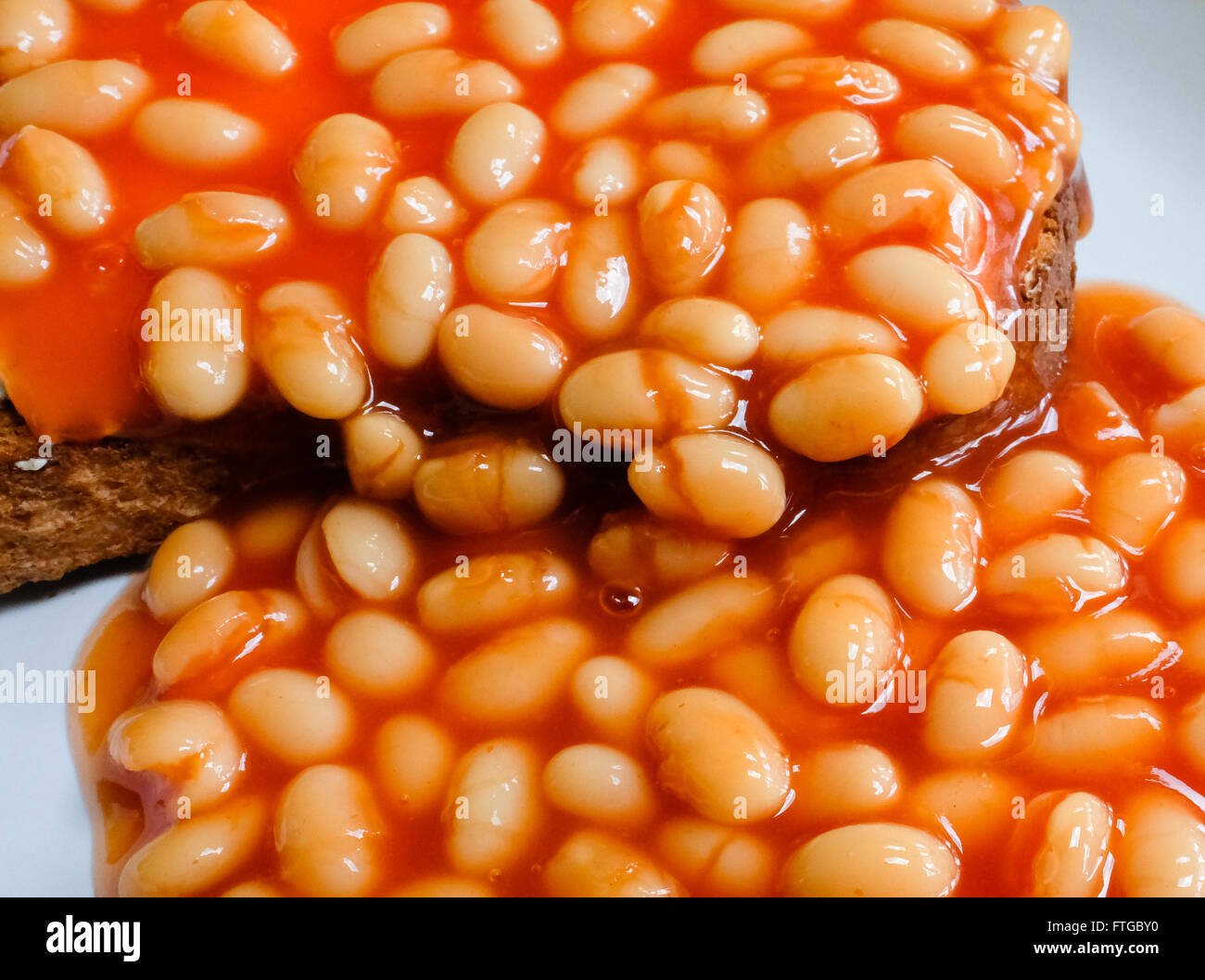 Freshly cooked baked beans on toast served on wholemeal bread as seen in a cafe Stock Photo Alamy