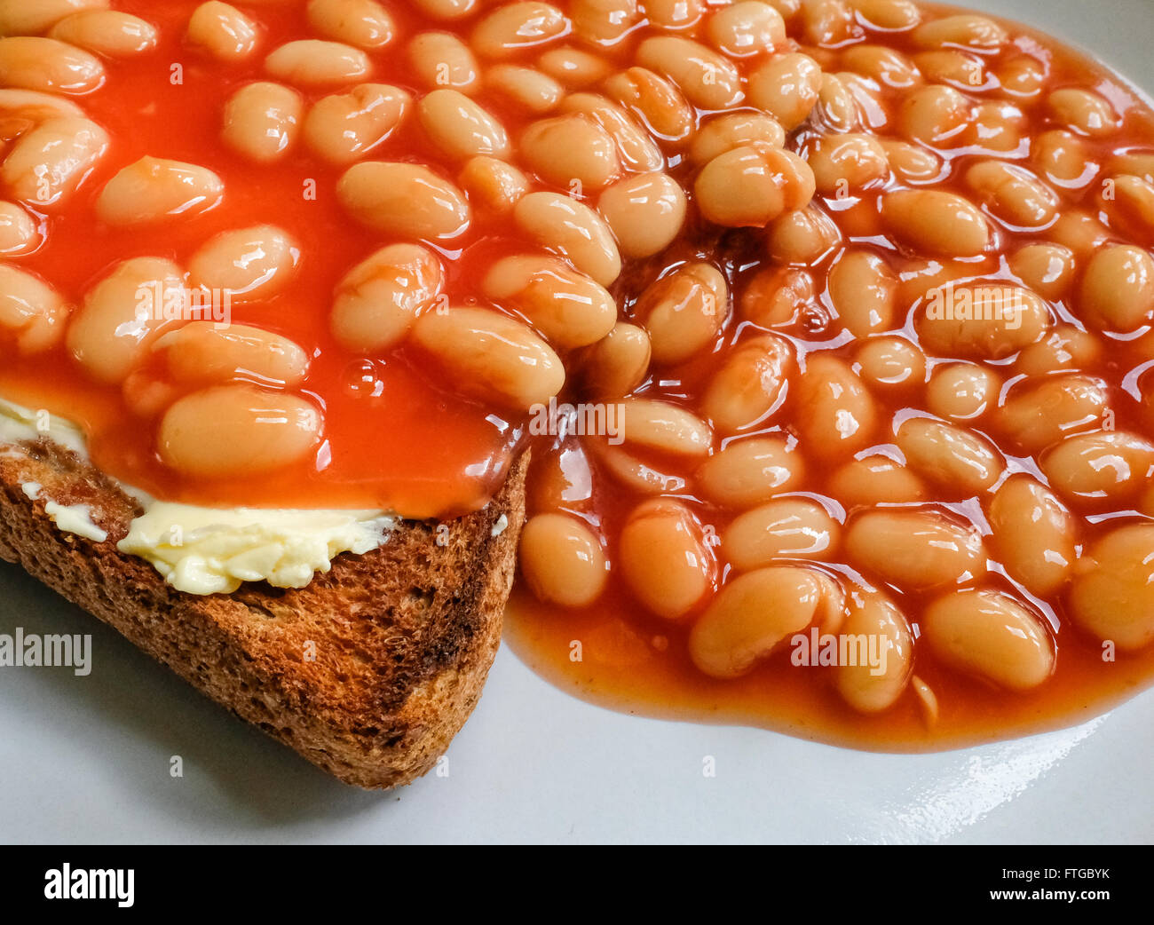 Freshly cooked baked beans on toast served on wholemeal bread as seen