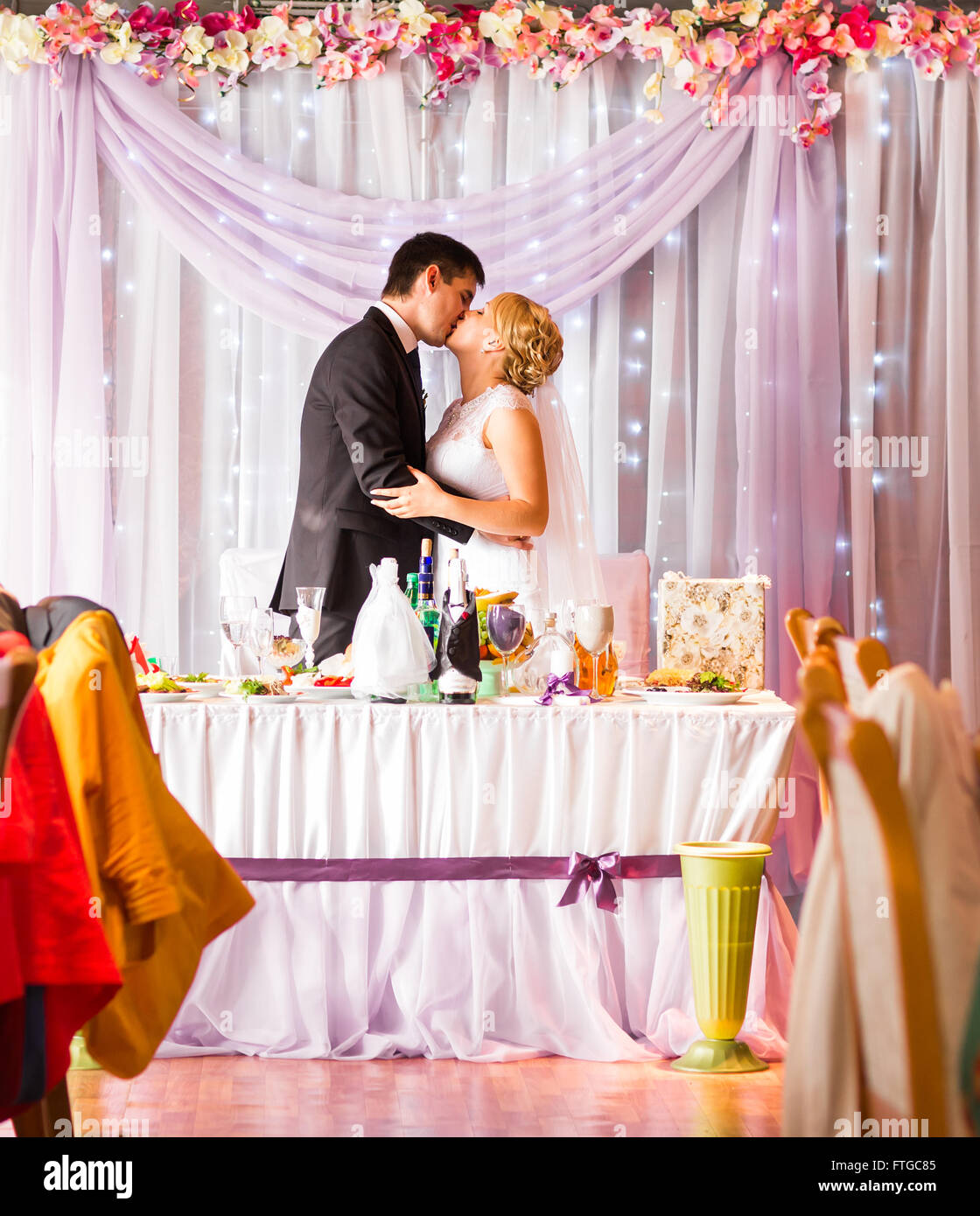 Bride And Groom Enjoying Meal At Wedding Reception Stock Photo - Alamy