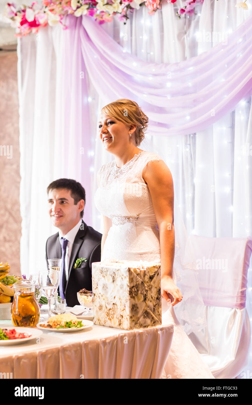 Bride And Groom Enjoying Meal At Wedding Reception Stock Photo - Alamy