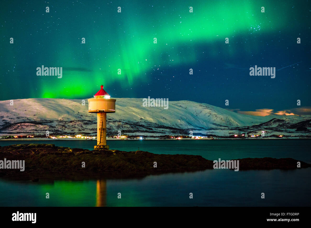 Aurora Borealis dancing over fjord, Tromso Northern Norway Stock Photo ...