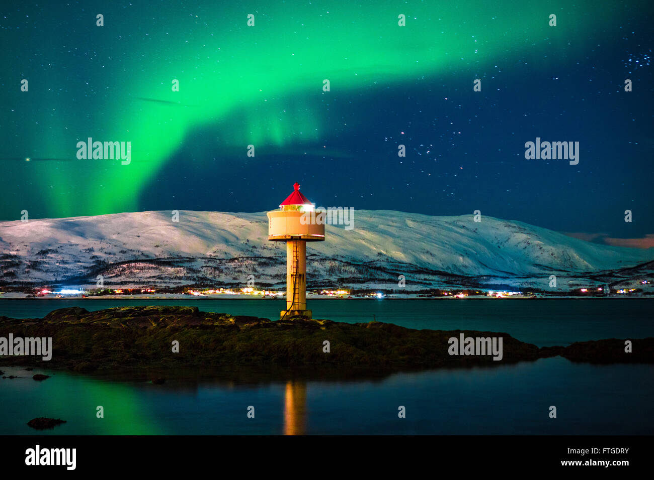 Aurora Borealis dancing over fjord, Tromso Northern Norway Stock Photo ...