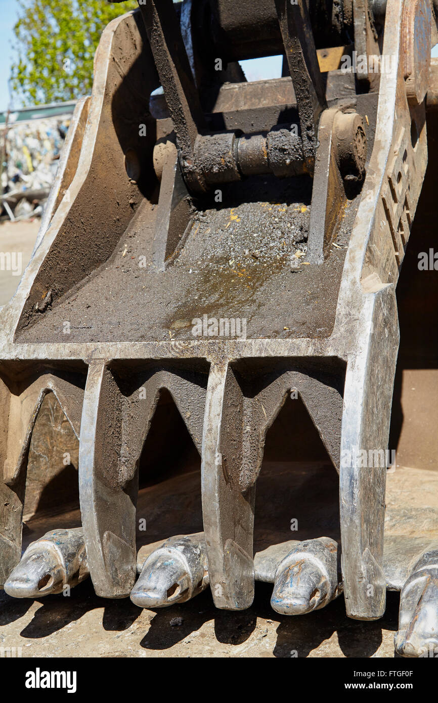 Heavy equipment excavator clamshell thumb bucket Stock Photo