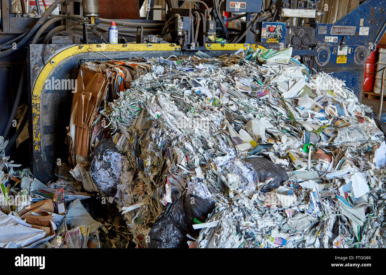 Paper refuse scrap rubbish recycling bailing compaction machine Stock Photo