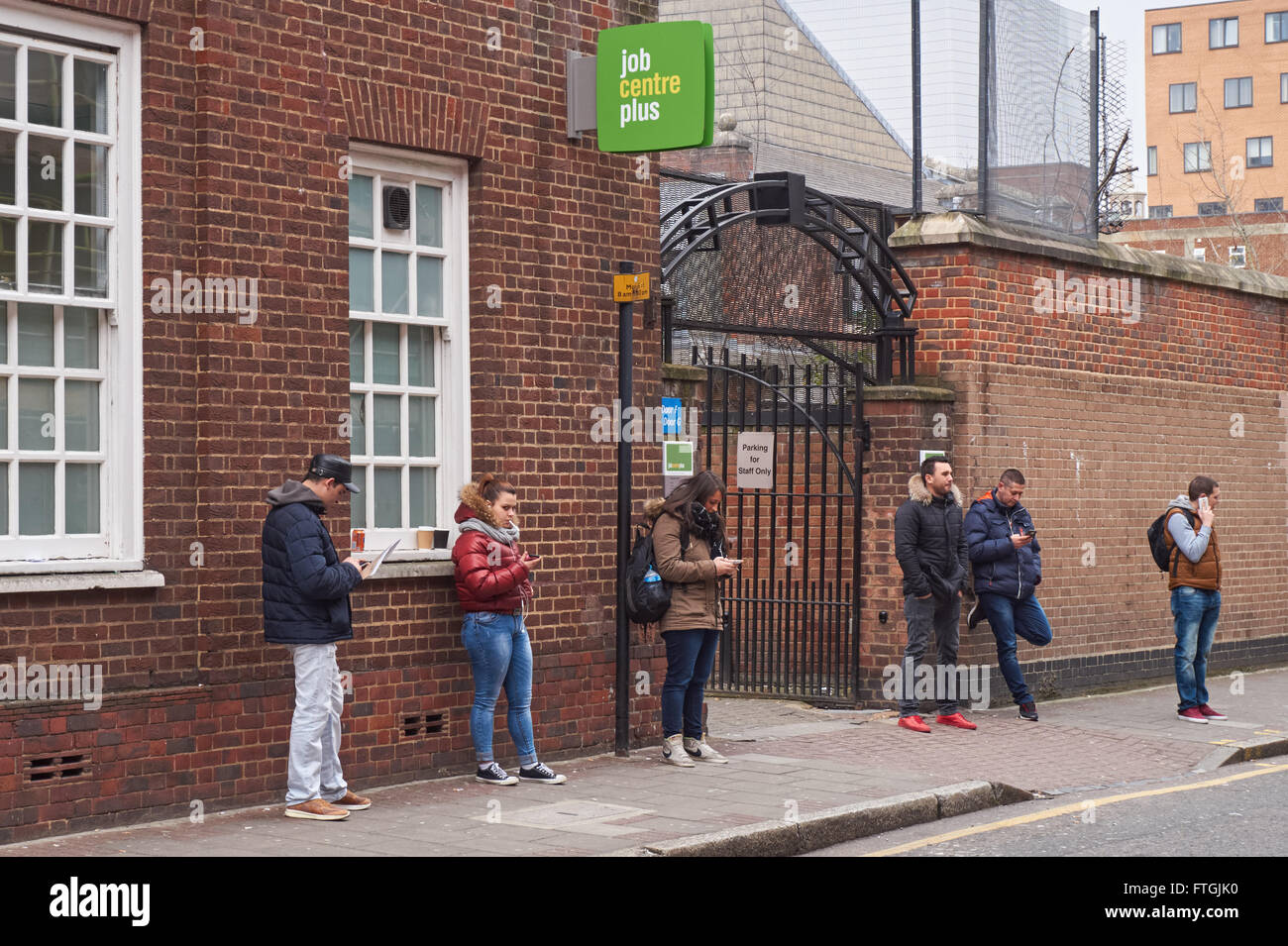 People outside Job Centre Plus office at Whitechapel, London England