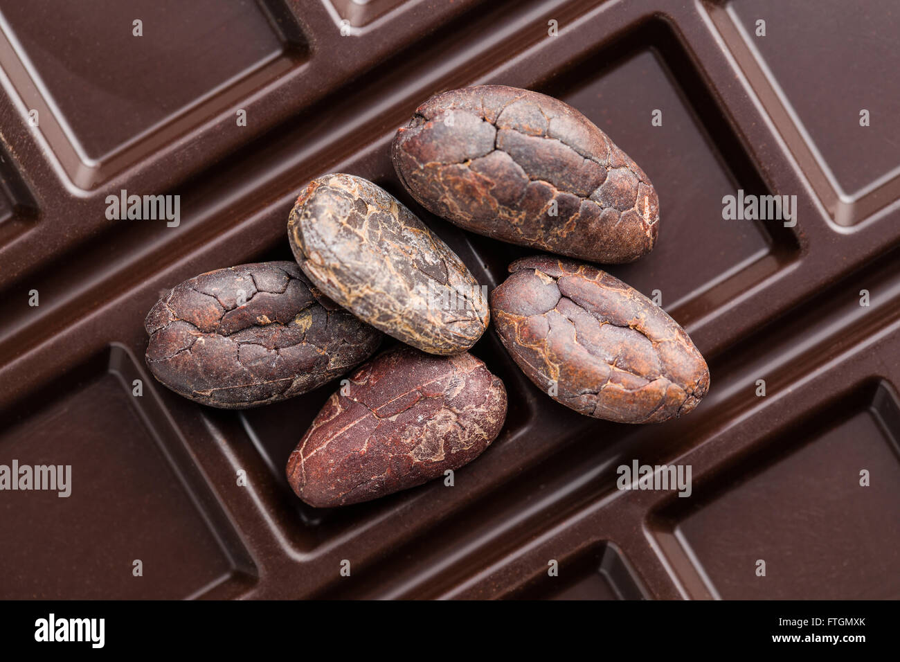 cocoa beans and chocolate bars on white background Stock Photo