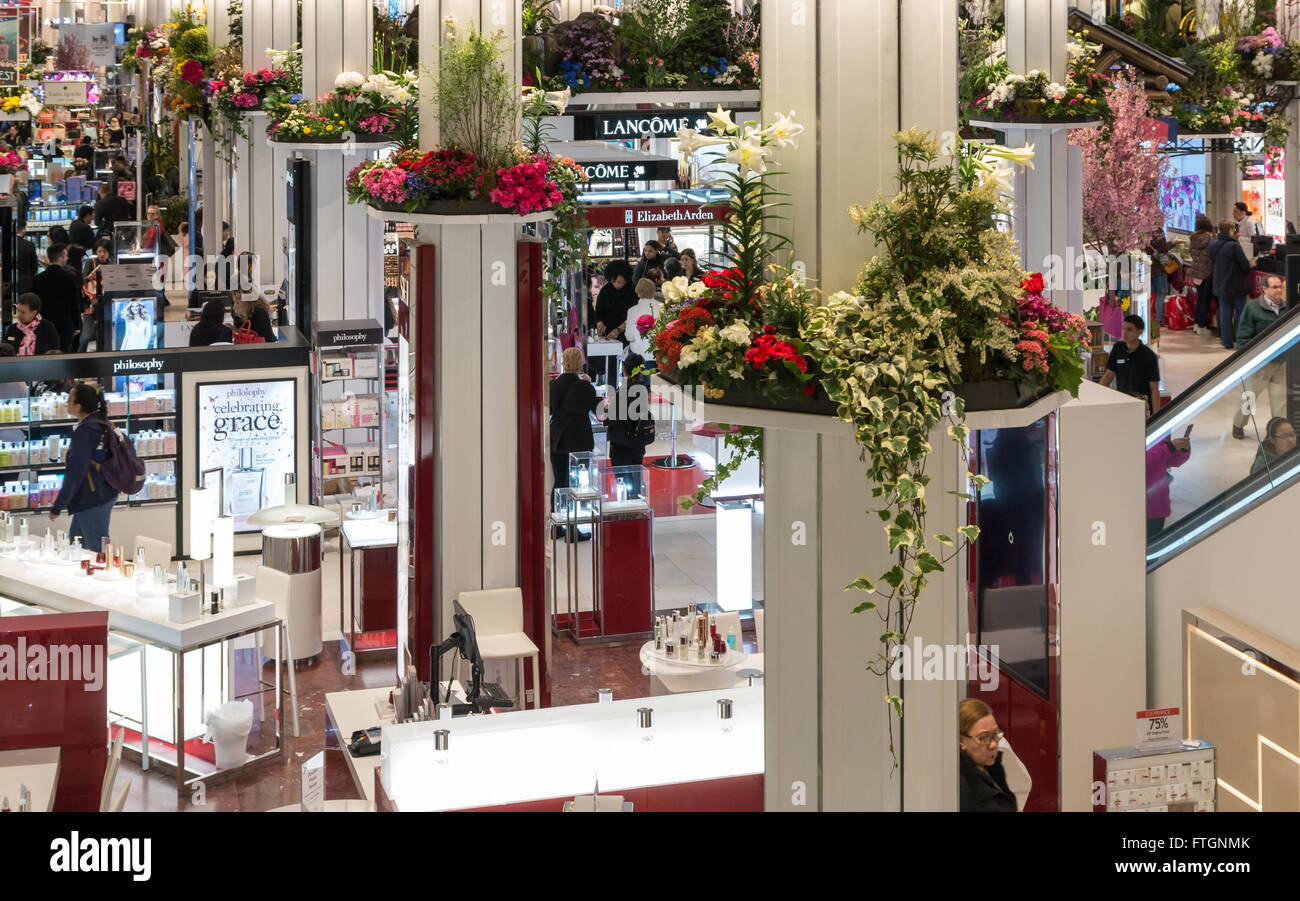 Macy's annual Flower Show: Looking down to the interior of store's cosmetics department decorated with flowers and plants Stock Photo
