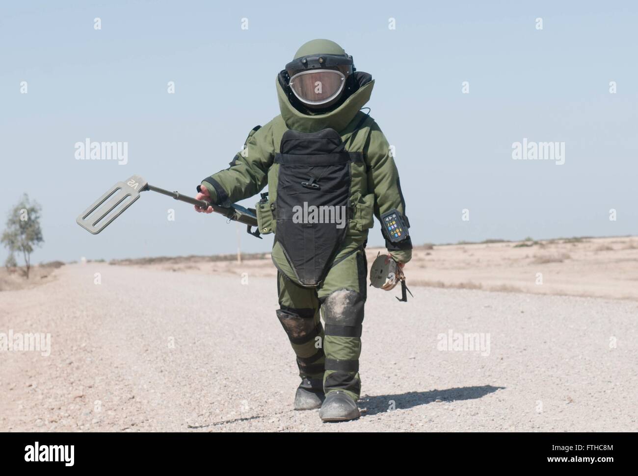 A U.S. Explosive Ordnance Disposal technician completes a field sweep