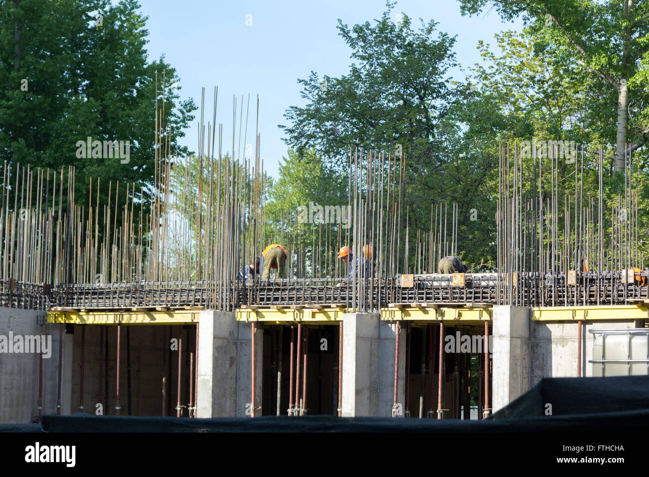 workers attach reinforcement at a construction site Stock Photo - Alamy