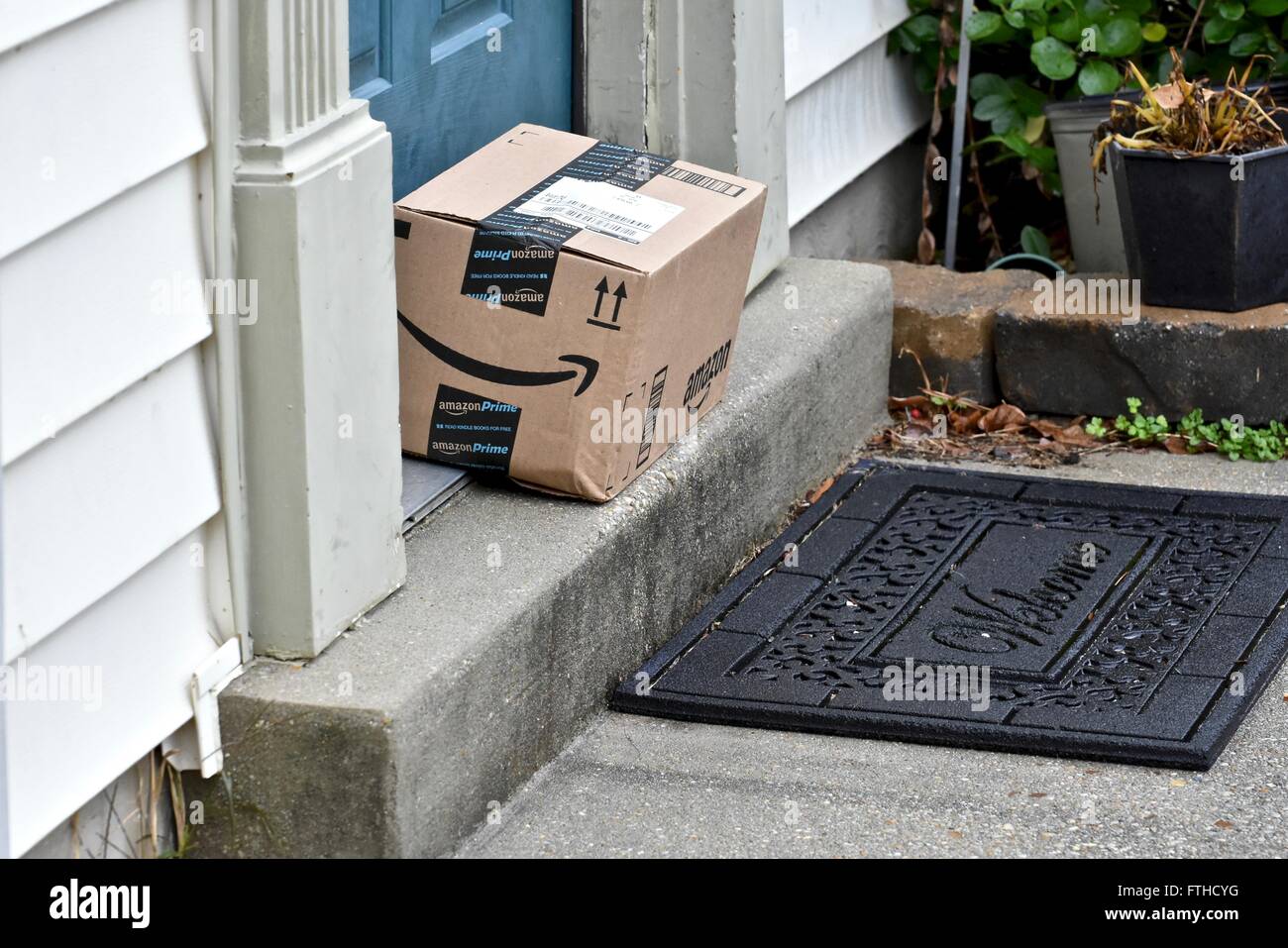 Amazon box delivered to the front door of a home Stock Photo Alamy