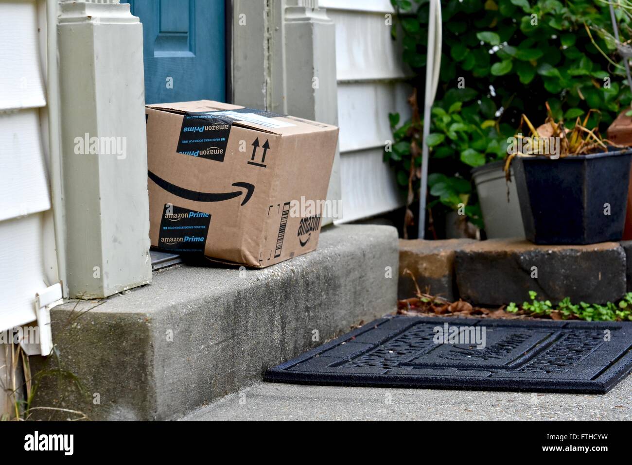Amazon box delivered to the front door of a home Stock Photo Alamy