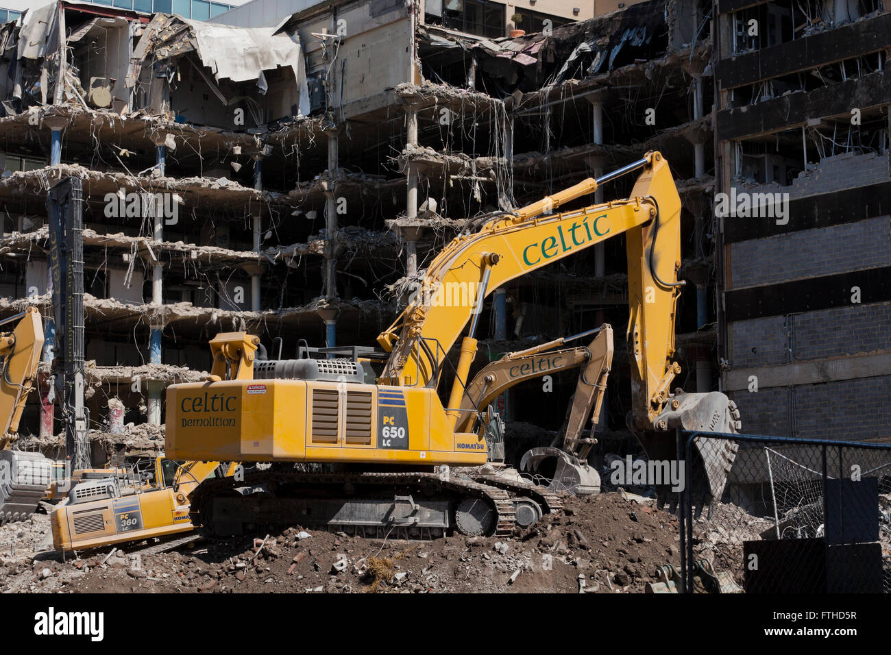 Caterpillar excavator at building demolition site - Washington, DC USA Stock Photo