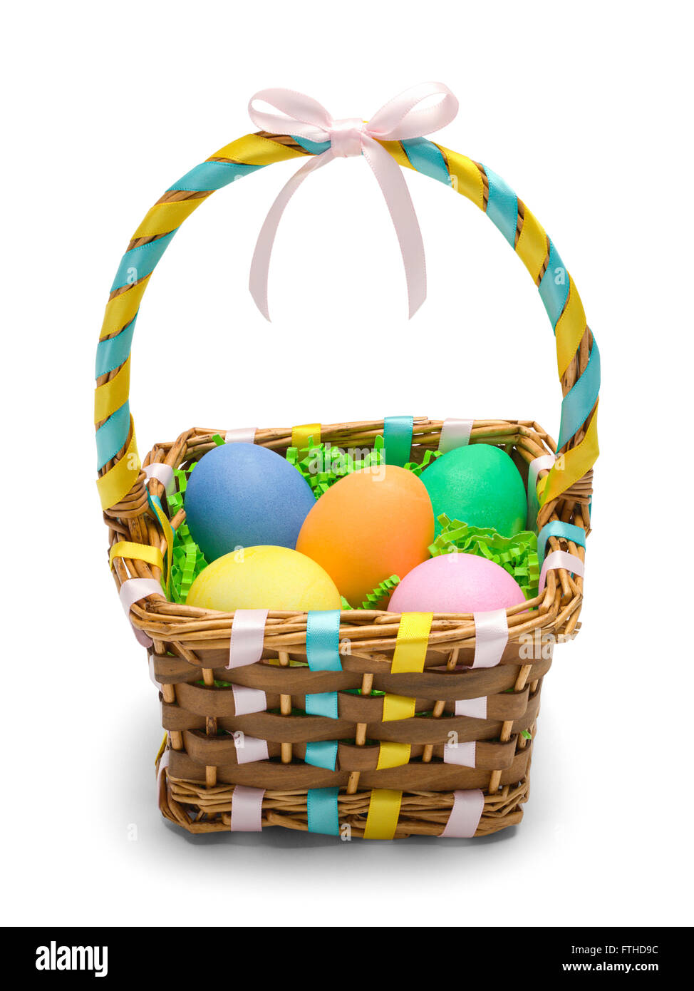 Easter Basket with Colored Eggs Isolated on White Background. Stock Photo