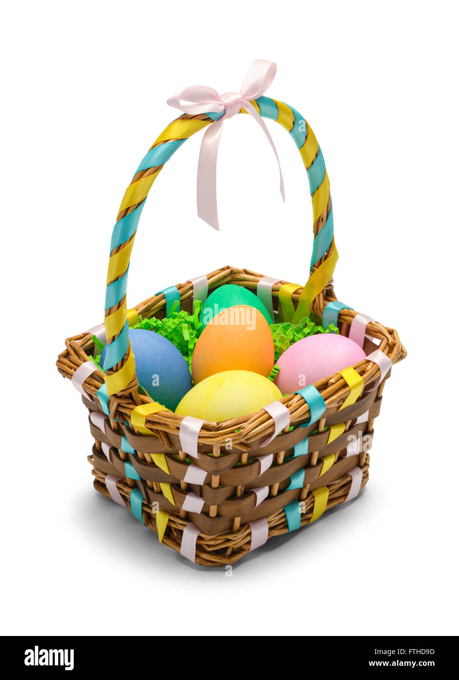 Easter Basket with Colored Eggs Isolated on White Background. Stock Photo