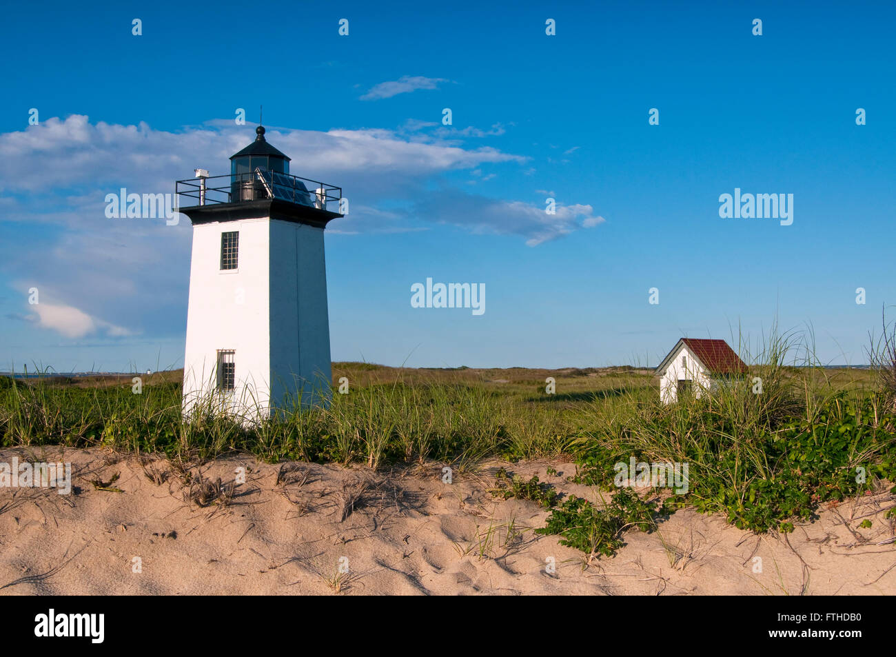 Wood End Lighthouse on a sunny summer day along the beach outside of
