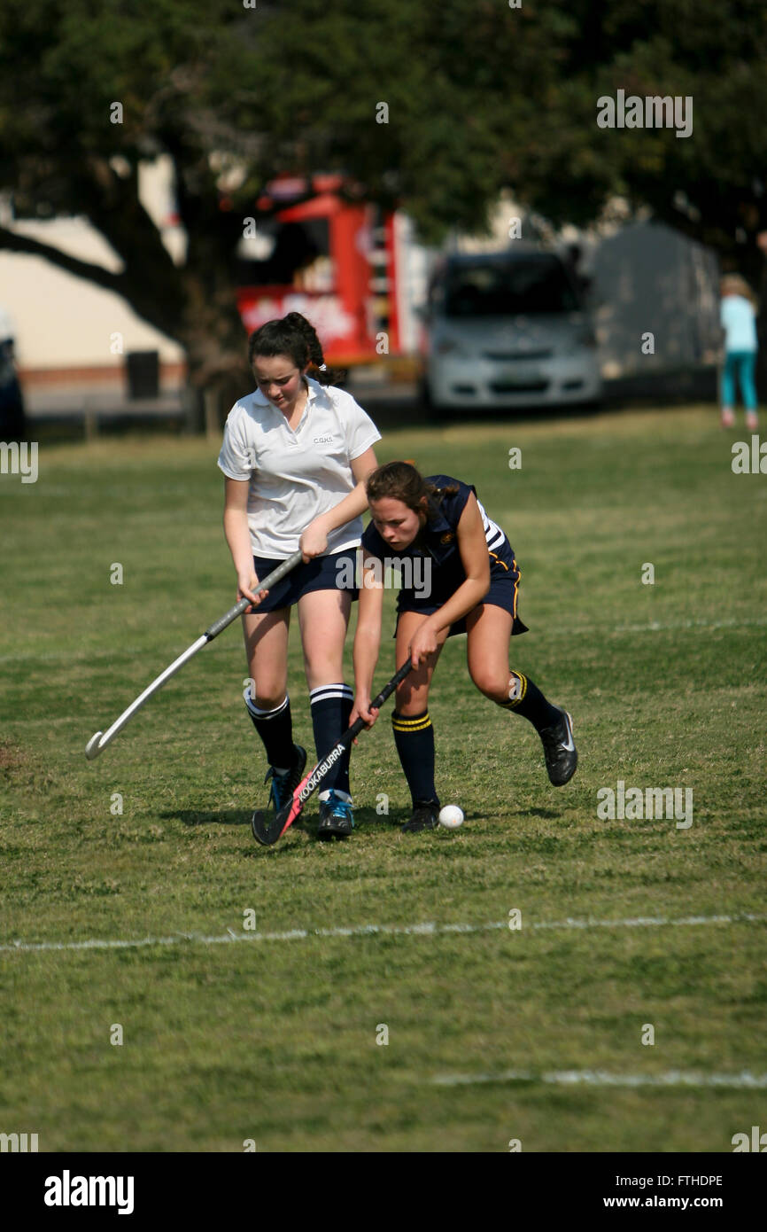 playing school hockey on grass Stock Photo Alamy